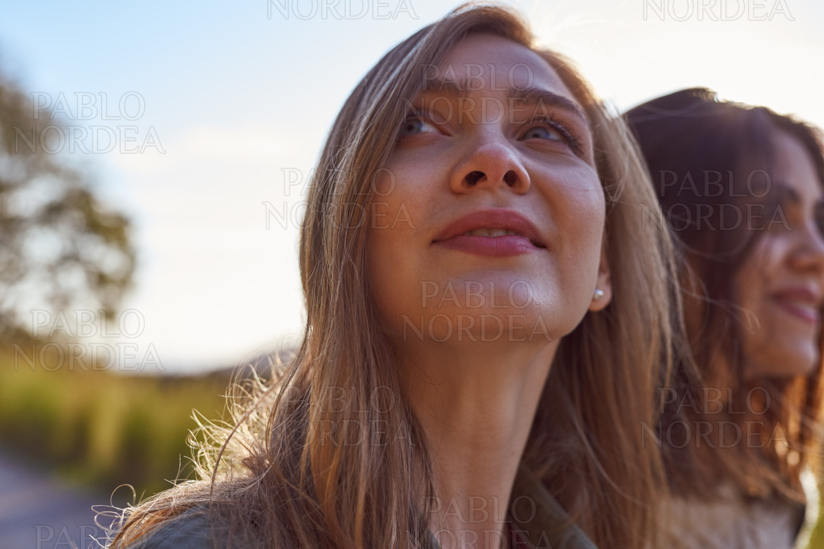 Beautiful woman in mountains looking up stock photo