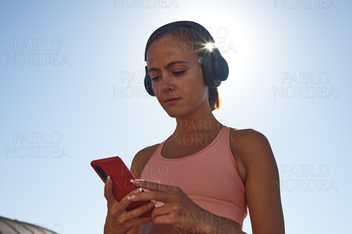 Portrait of woman listening to music stock photo