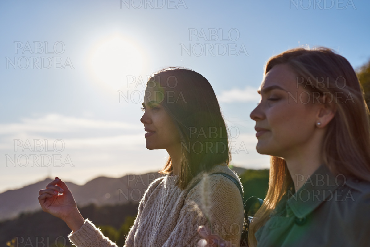 Two engrossed ladies enjoying natures beauty stock photo