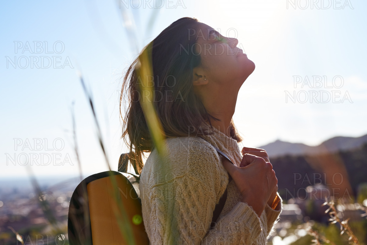 Young woman facing up with her eyes closed stock photo
