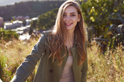 Portrait of beautiful smiling woman in mountains