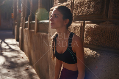 Woman leans forward slightly as she looks up