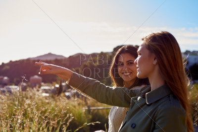 Woman pointing towards the view outdoors