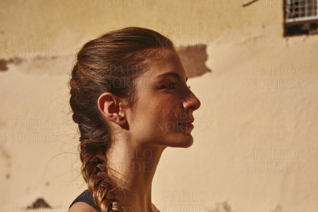 Side view of a woman looking into the distance
