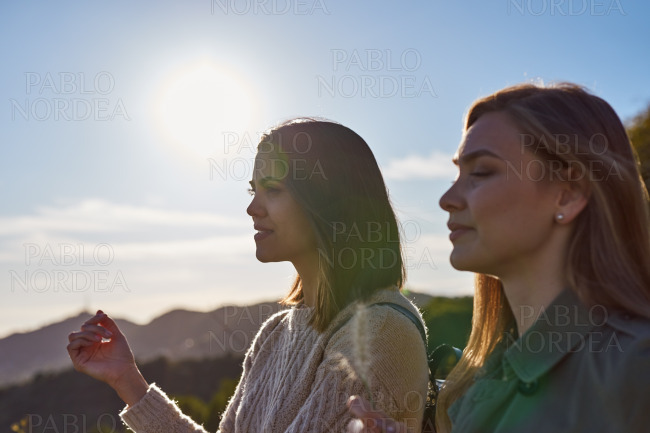 Two engrossed ladies enjoying natures beauty