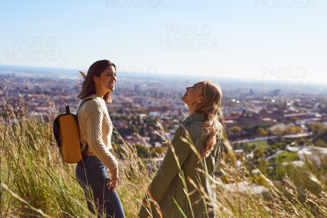 Two young women hiking together outdoors