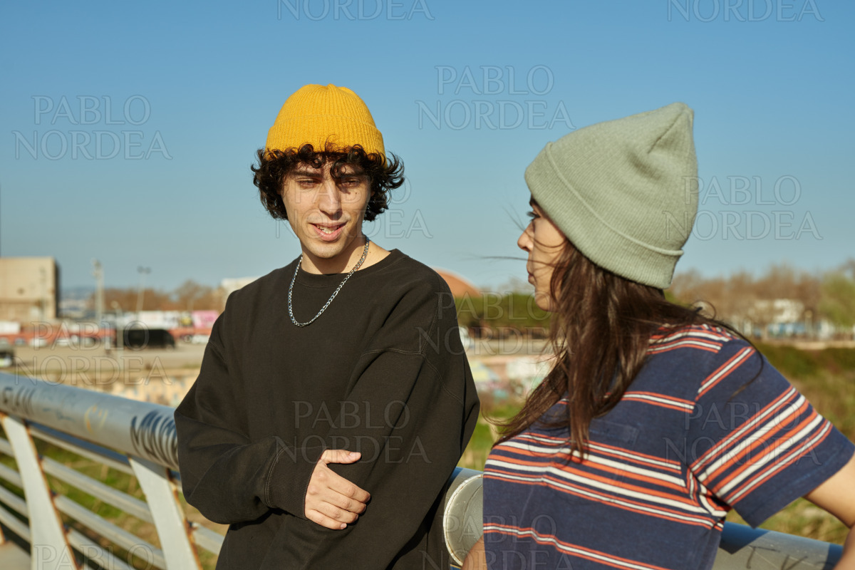 Cute young couple having a chat outdoors stock photo