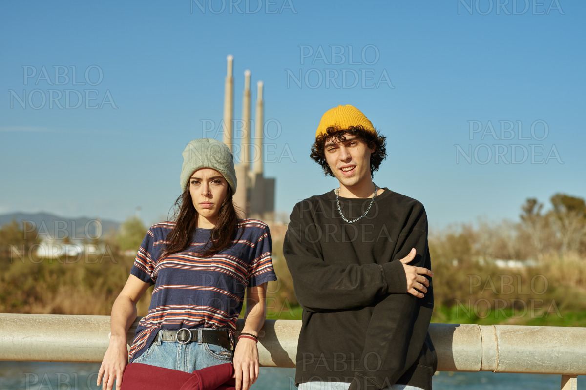 Cute young couple looking at you stock photo