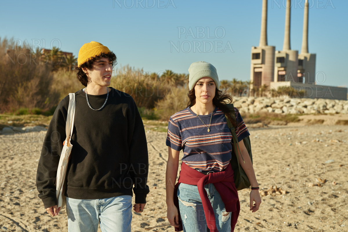 Young caucasian couple taking a walk outdoors stock photo