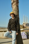 Young man looking at camera outdoors
