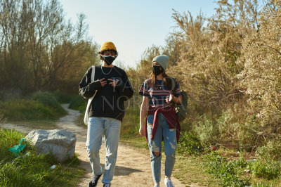 Attractive couple talking while walking together