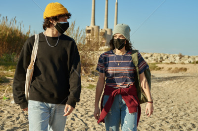Cute caucasian couple walking together outdoors