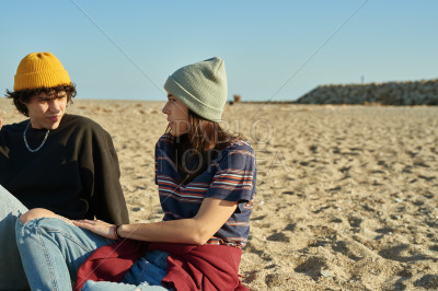 Cute young couple discussing something outdoors
