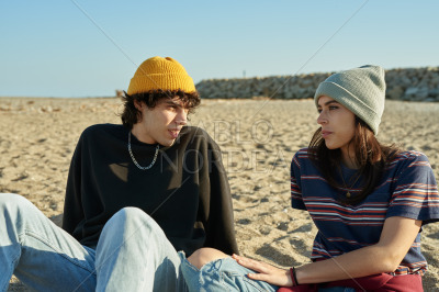 Cute young couple having a discussion outdoors