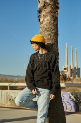 Handsome young man looking away outdoors