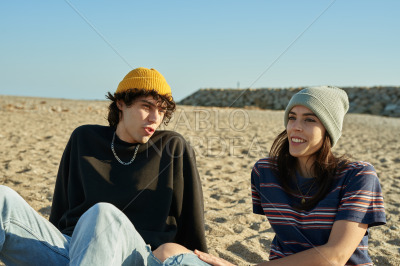 Happy young couple having a chat outdoors