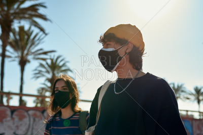 Two immersed people taking a casual stroll
