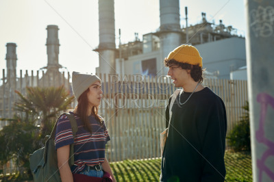 Two involved young people having a chat outside