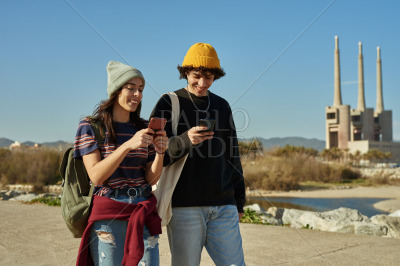 Two merry young people talking a walk