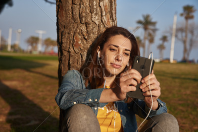 Woman looks at her cell phone