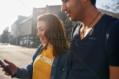 Young couple standing on a city street together