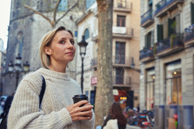 Young woman looking thoughtful in the city