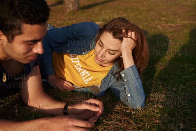 Young couple enjoying the outdoors on a sunny day stock photo