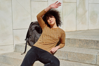 Beautiful girl blocking the sun with her hand