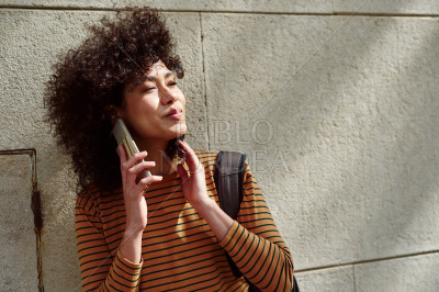 Beautiful girl making a phone call outdoors