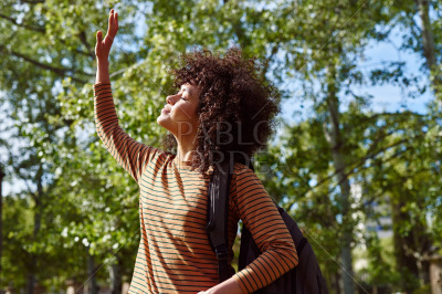 Cute young woman enjoying the sun outdoors