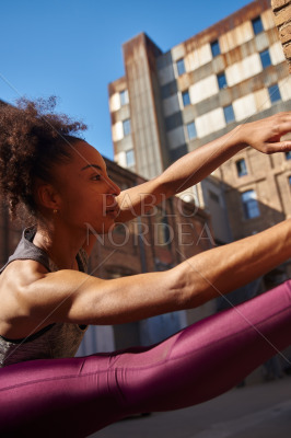 Dedicated young woman working out outdoors