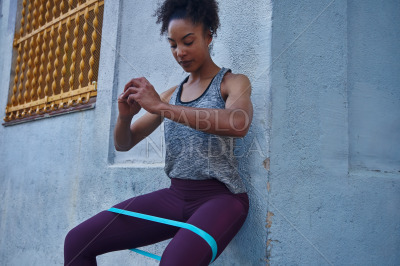 Fit woman working out with a resistance band