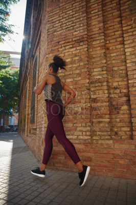 Sporty young woman jogging in the city