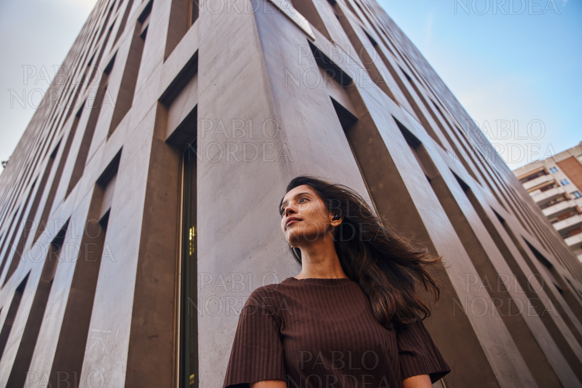 Beautiful businesswoman standing and looking away stock photo