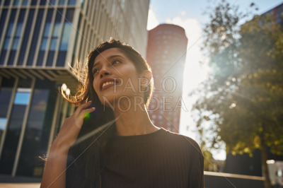 Portrait of smiling businesswoman on street
