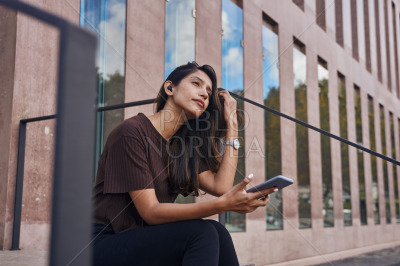 Young attractive businesswoman with mobile phone