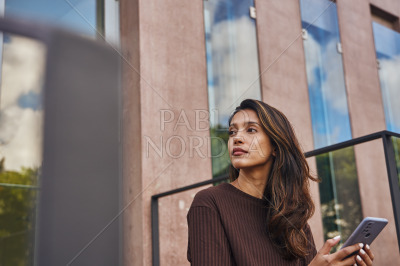 Young beautiful businesswoman looking and thinking