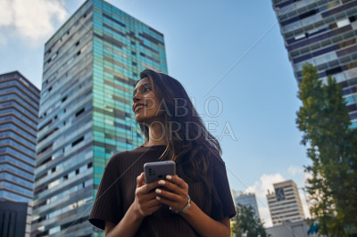 Young beautiful businesswoman standing and smiling