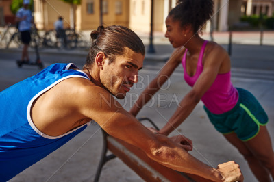 Young couple exercising together in the city