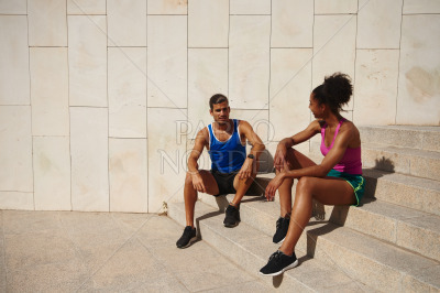 Young couple having a chat while resting together