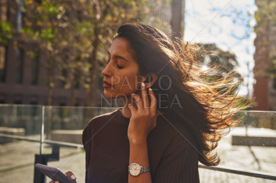 Young pretty businesswoman with mobile phone