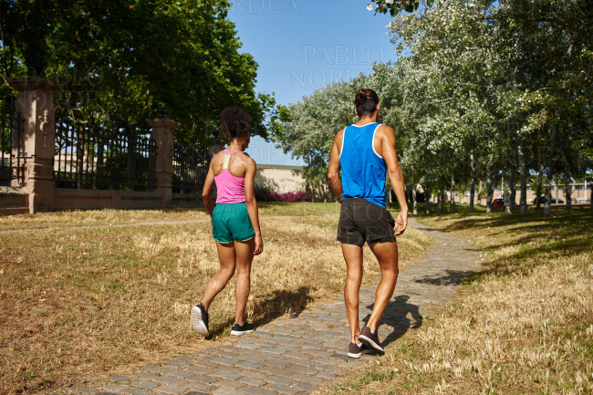 Rearview of a sporty couple walking together