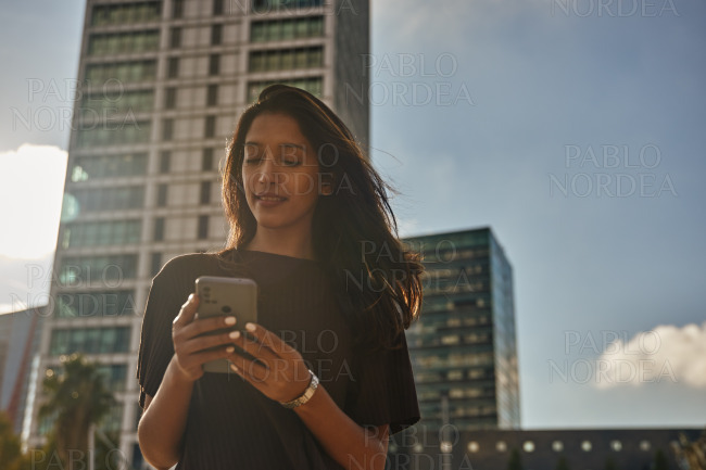 Young businesswoman in front of building