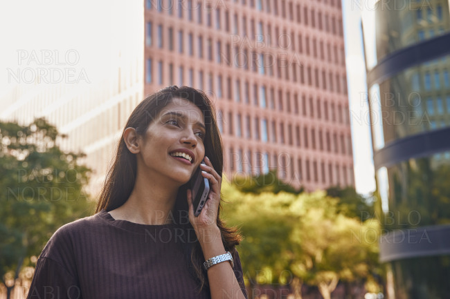 Young smiling businesswoman with mobile phone