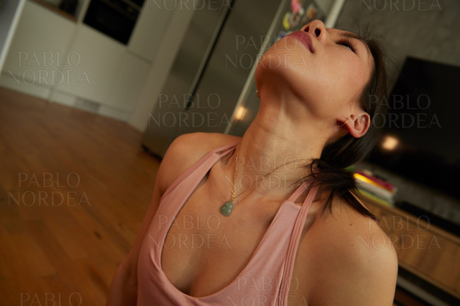 Young woman looking up while practicing yoga