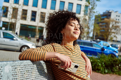 Cute young woman sitting with eyes closed