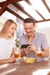 Happy couple looking at a cellphone