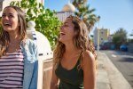 Two beautiful young girls laughing uncontrollably
