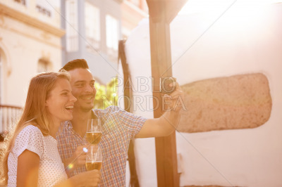 Beer dinking couple posing for selfie
