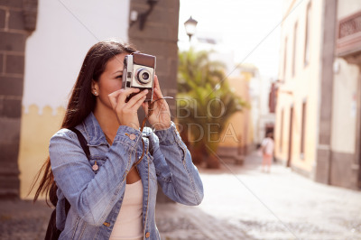 Cute young lady taking a picture